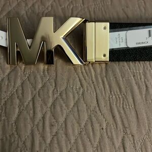 Michael Kors reversible Black Belt. Gold MK Initials as belts buckle. Size 2x